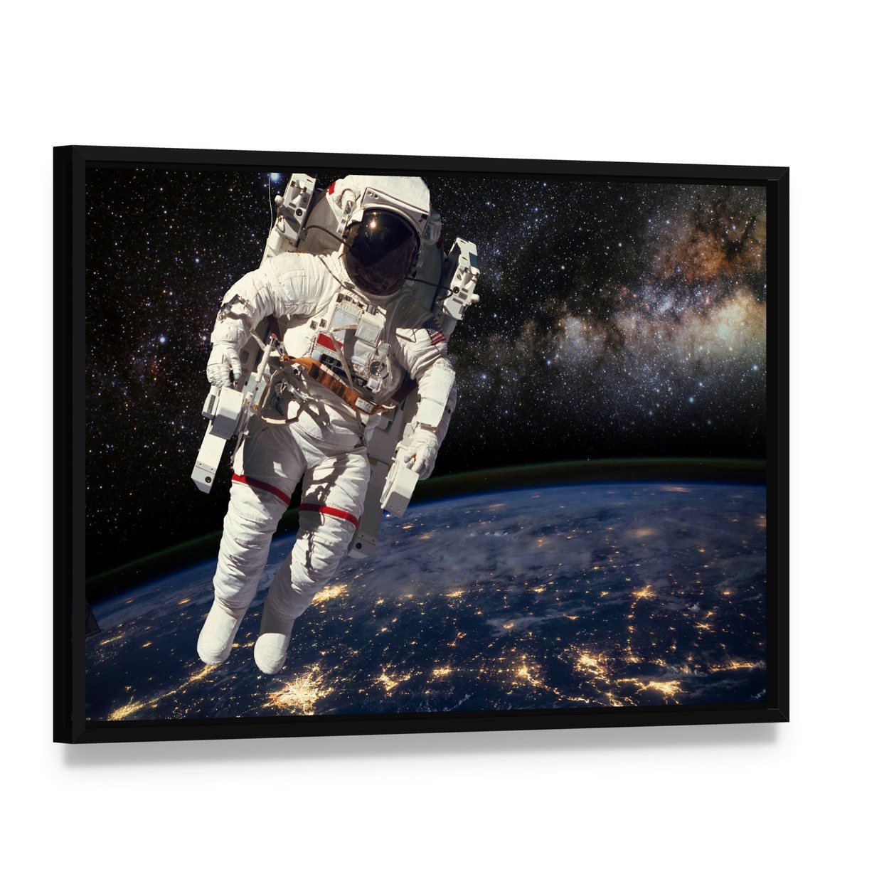 Astronaut and Milky Way Canvas Wall Art, framed canvas in a black floater frame, angled product view