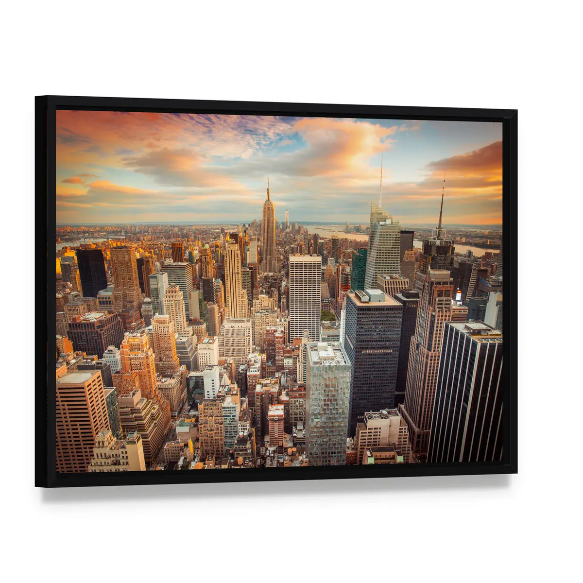 New York City At Sunset Canvas Wall Art, framed canvas in a black floater frame, angled product view