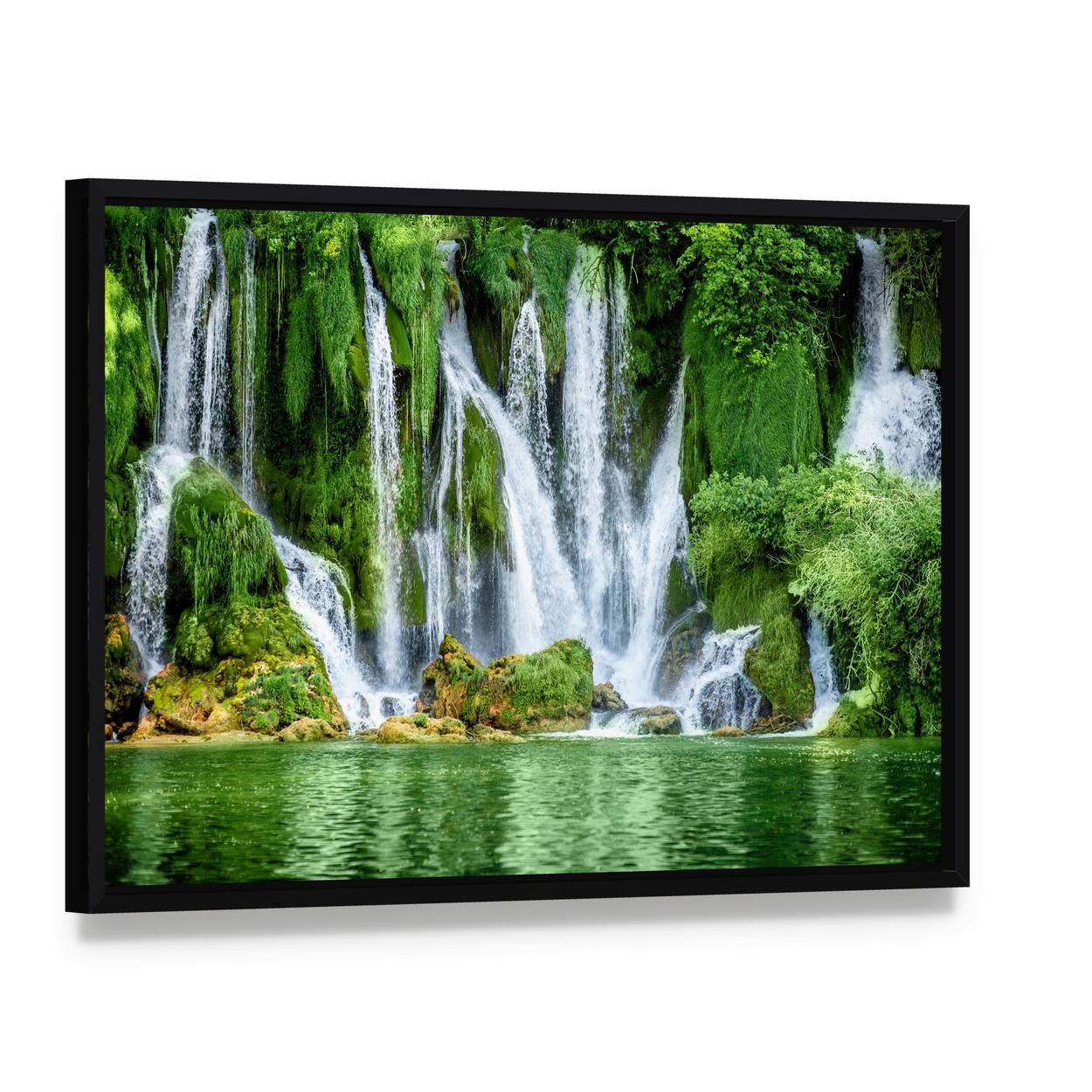 Kravica Waterfall Canvas Wall Art, framed canvas in a black floater frame, angled product view
