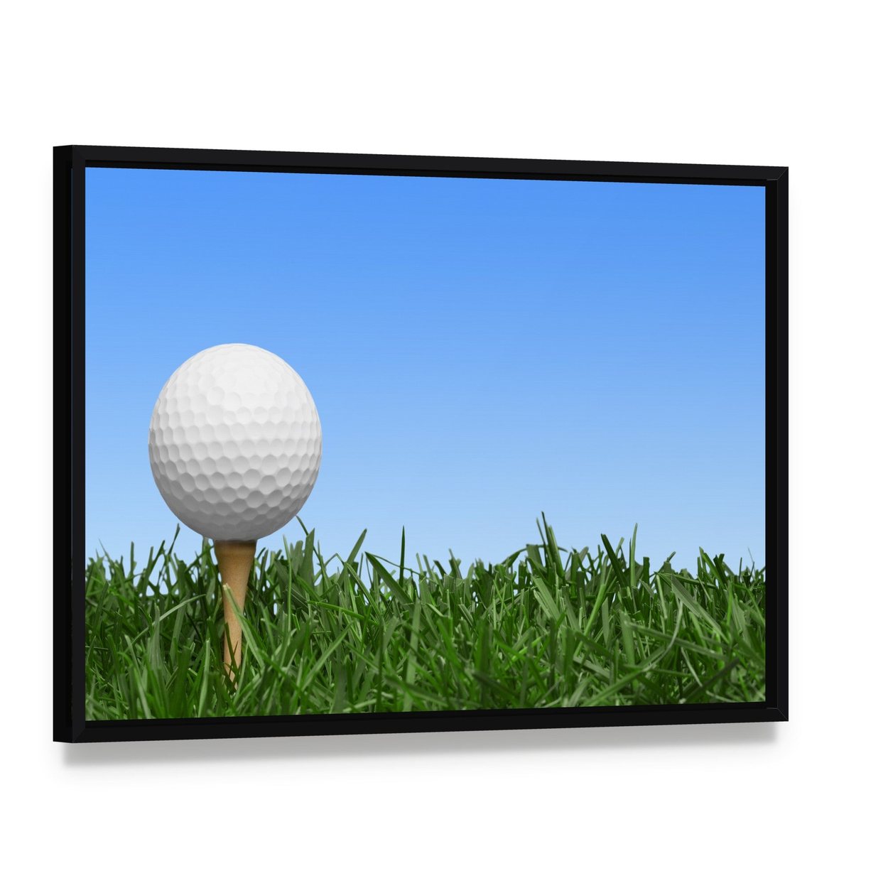 Golf Ball in Grass Canvas Wall Art, framed canvas in a black floater frame, angled product view