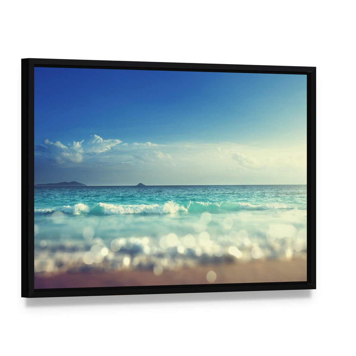 Beach Under Blue Sky Canvas Wall Art, framed canvas in a black floater frame, angled product view