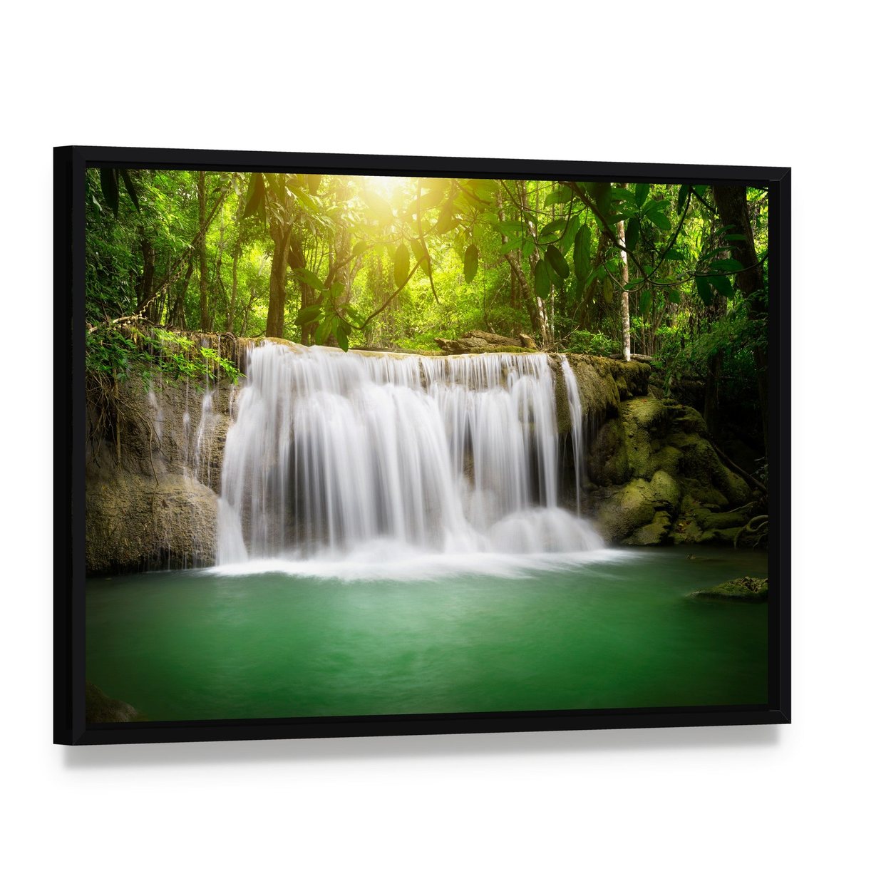 Waterfall in the Green Forest Canvas Wall Art, framed canvas in a black floater frame, angled product view