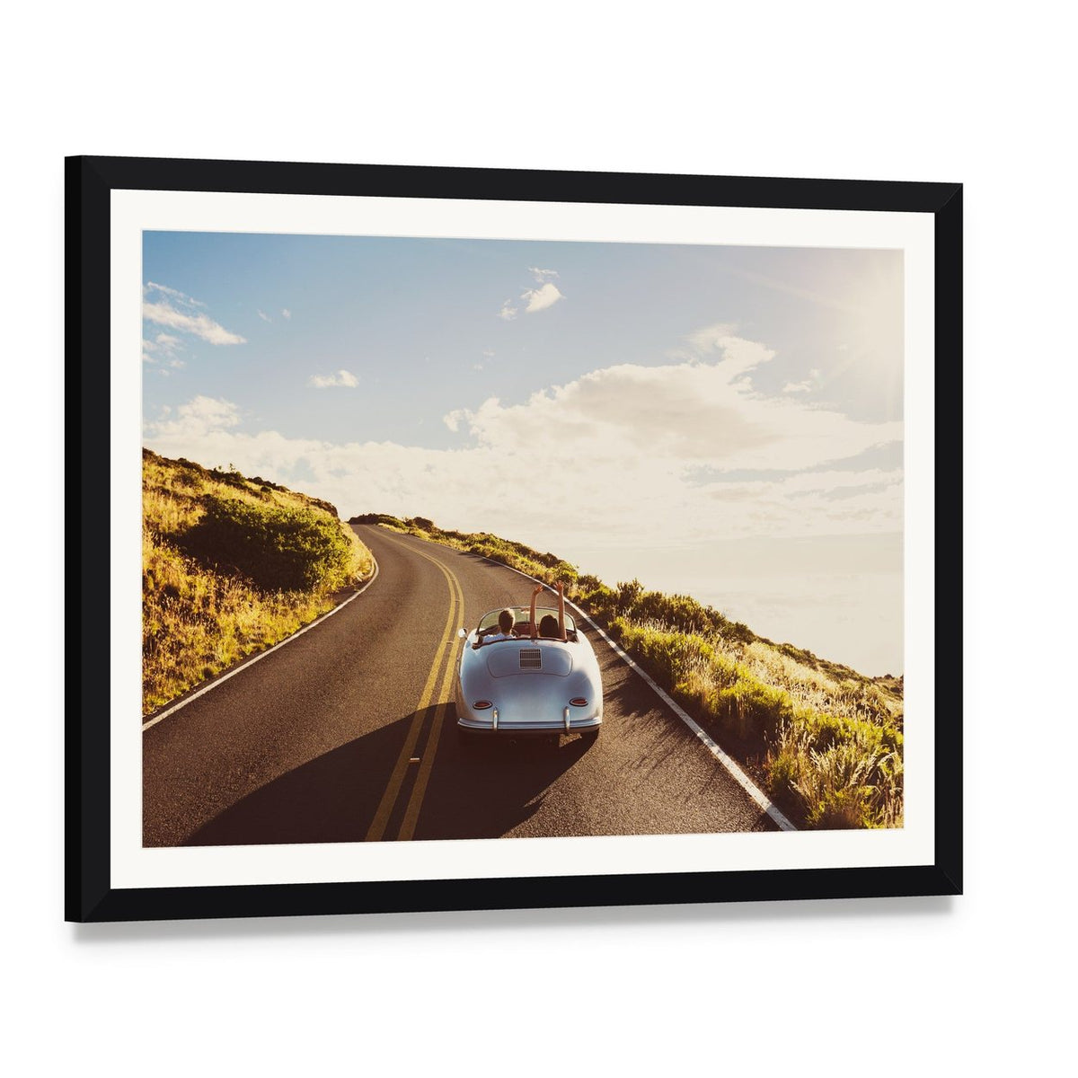 Happy Couple Driving Canvas Wall Art, framed print with white mat and black frame, angled product view