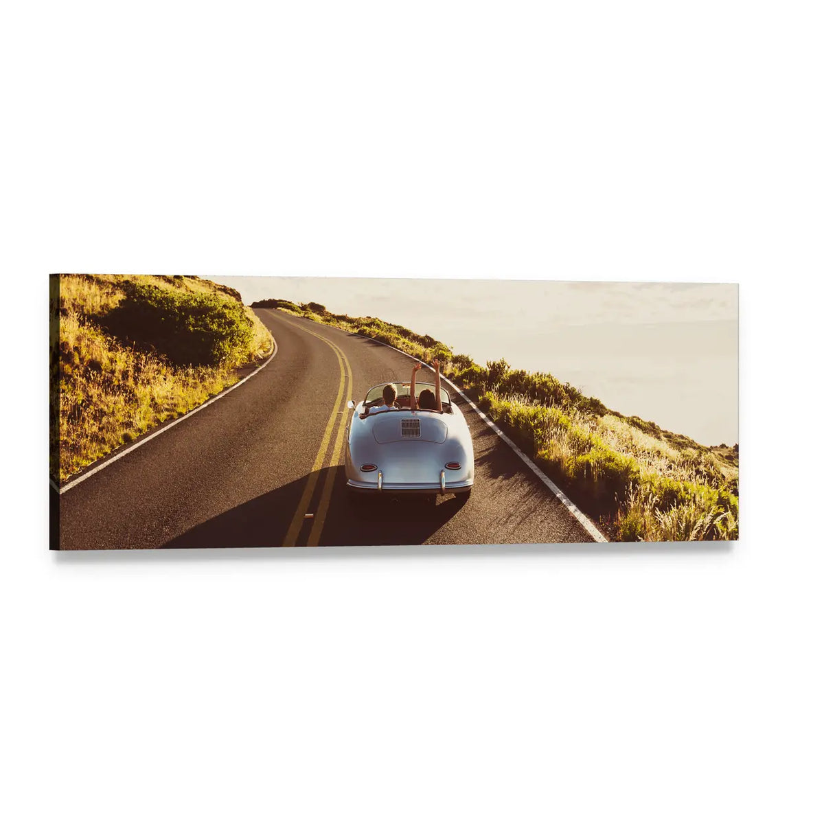 Couple Driving Vintage Convertible on Coastal Road Panoramic Canvas Wall Art, single panel gallery wrapped canvas, angled product view