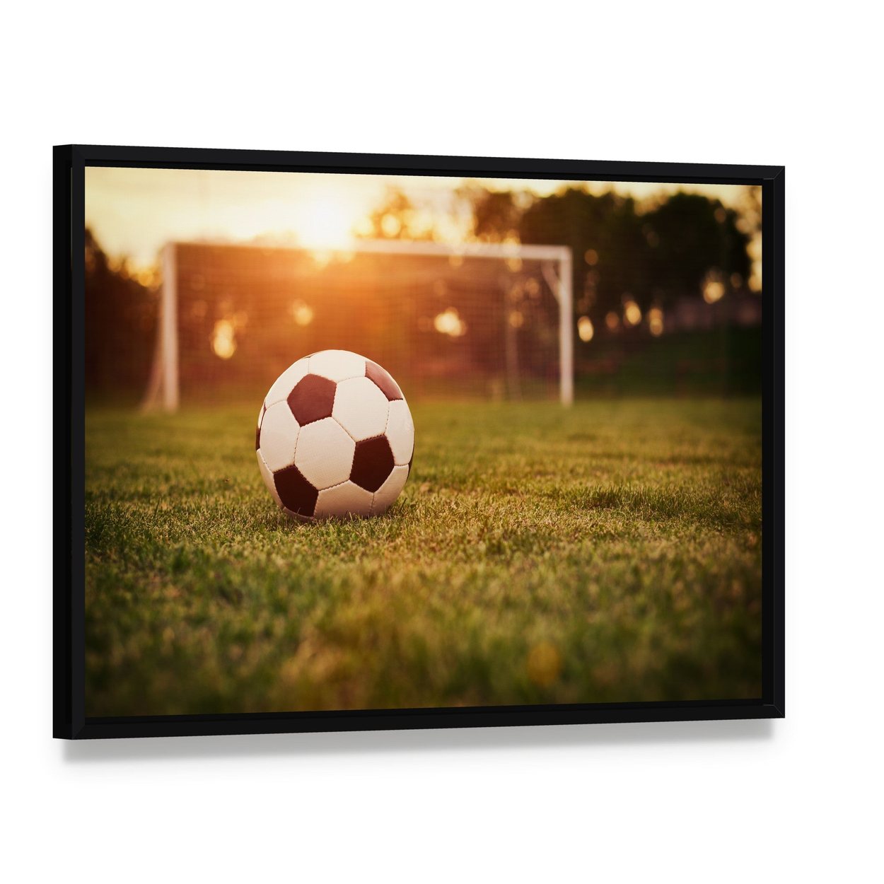 Soccer at Sunset Canvas Wall Art, framed canvas in a black floater frame, angled product view