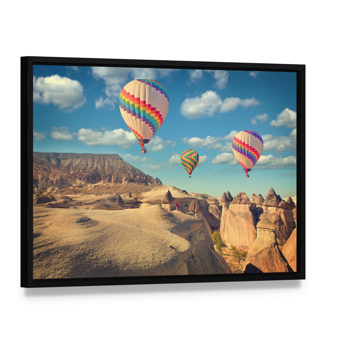 Hot Air Balloons Over Cappadocia Canvas Wall Art, framed canvas in a black floater frame, angled product view