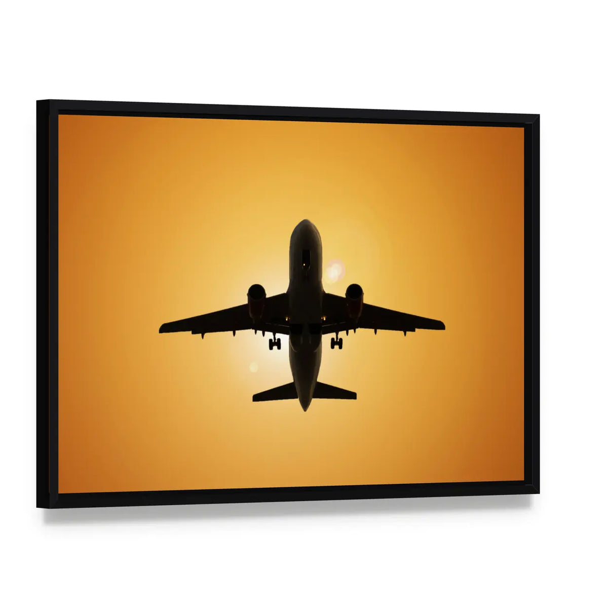 Airplane Silhouette Against the Sun Canvas Wall Art, framed canvas in a black floater frame, angled product view