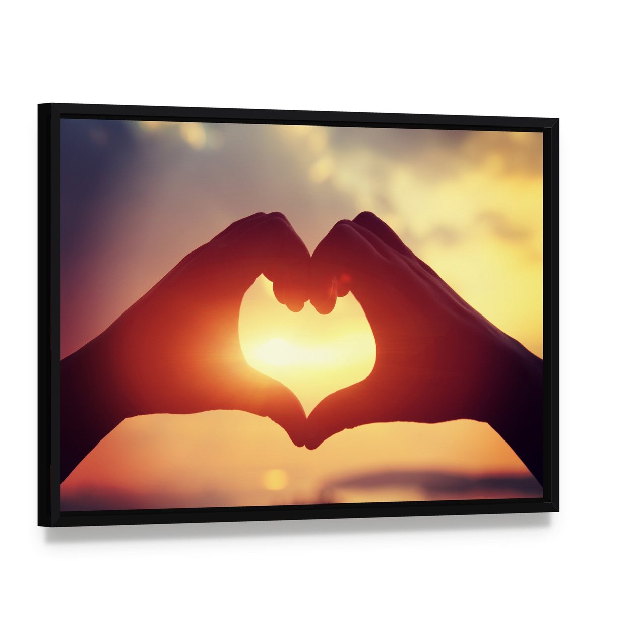 Hands Making Heart Shape Canvas Wall Art, framed canvas in a black floater frame, angled product view