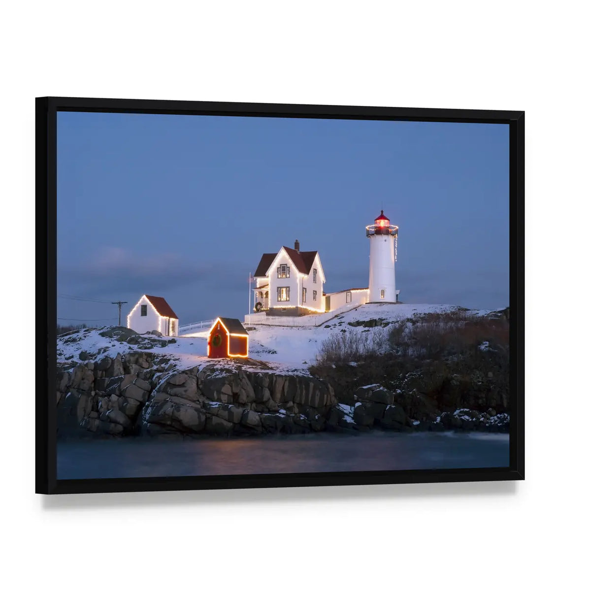 Nubble Lighthouse at Winter Dusk Canvas Wall Art, framed canvas in a black floater frame, angled product view