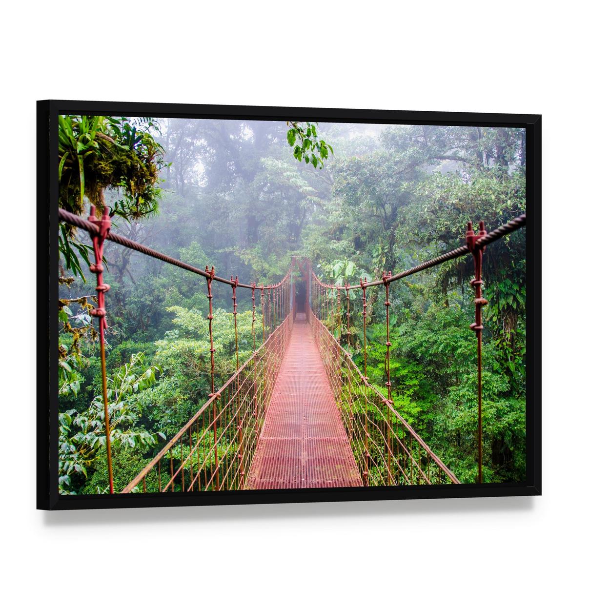 Red Suspension Bridge in Misty Forest Canvas Wall Art, framed canvas in a black floater frame, angled product view