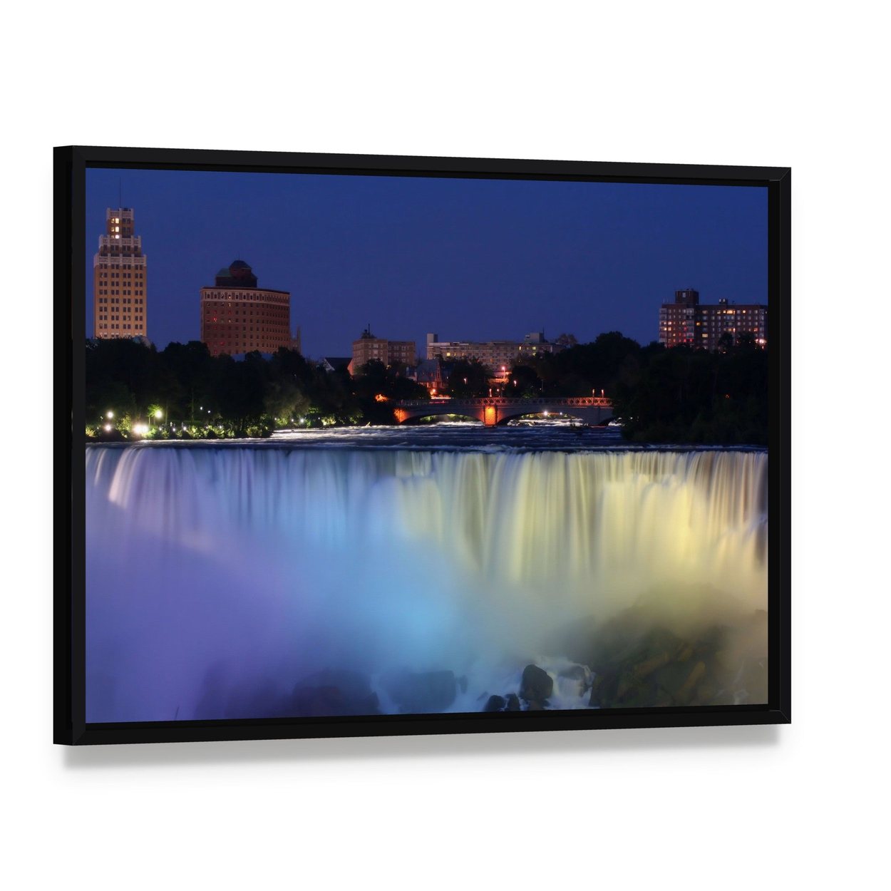 Waterfall with City Lights at Night Canvas Wall Art, framed canvas in a black floater frame, angled product view
