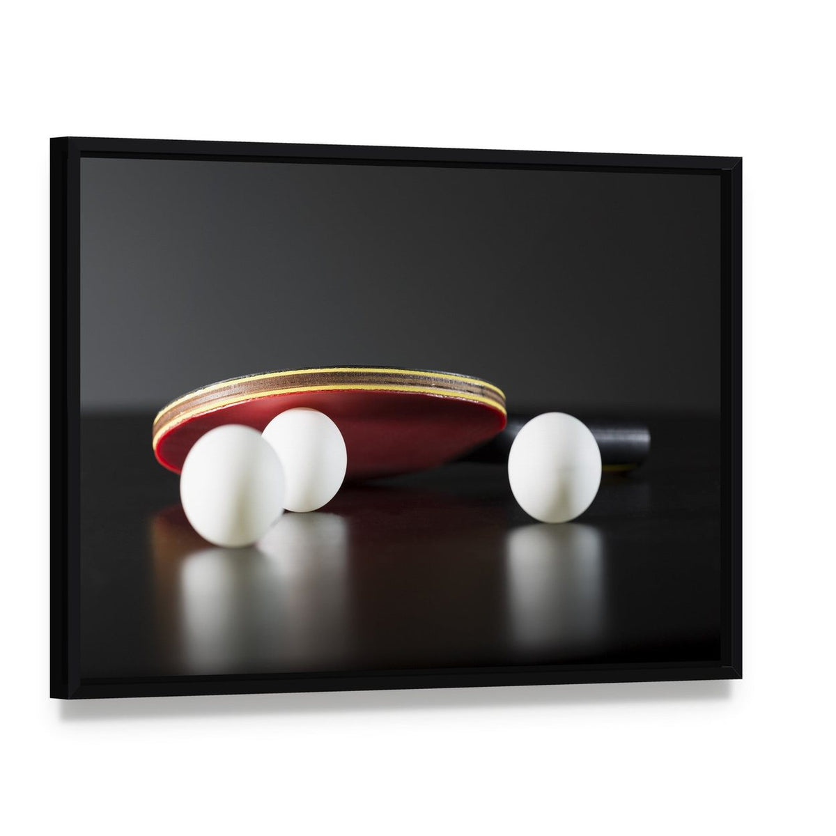 Table Tennis Racket and Balls Canvas Wall Art, framed canvas in a black floater frame, angled product view