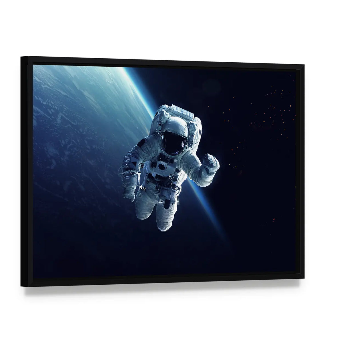 Astronaut in Space Canvas Wall Art, framed canvas in a black floater frame, angled product view