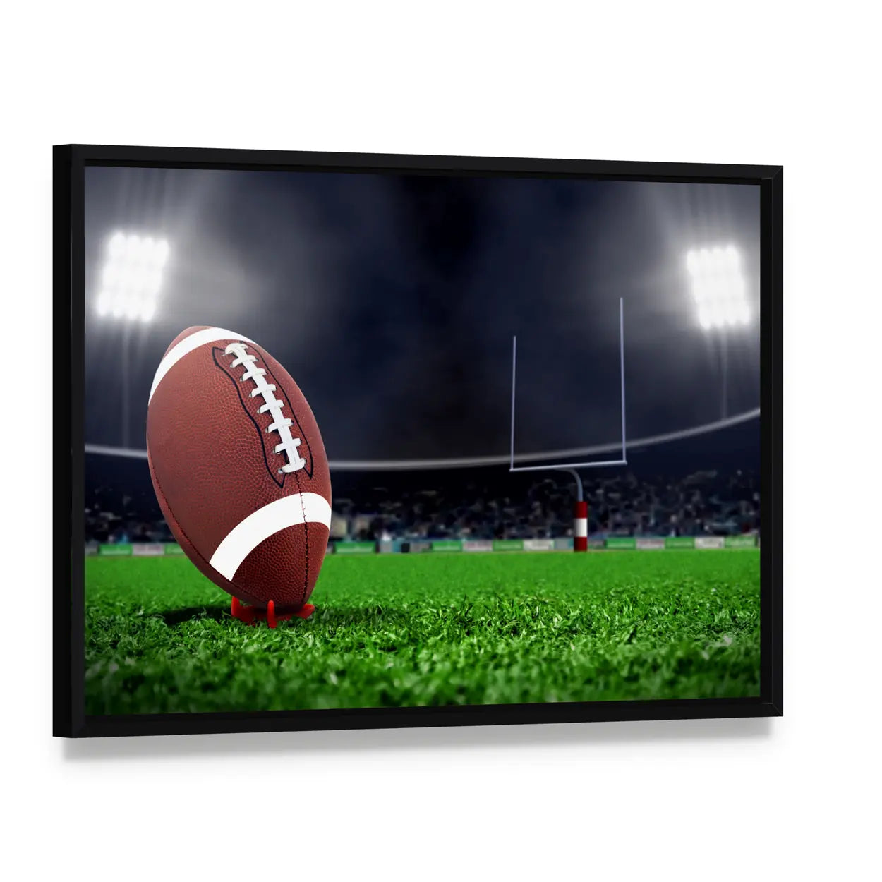 Football on Green Field Canvas Wall Art, framed canvas in a black floater frame, angled product view