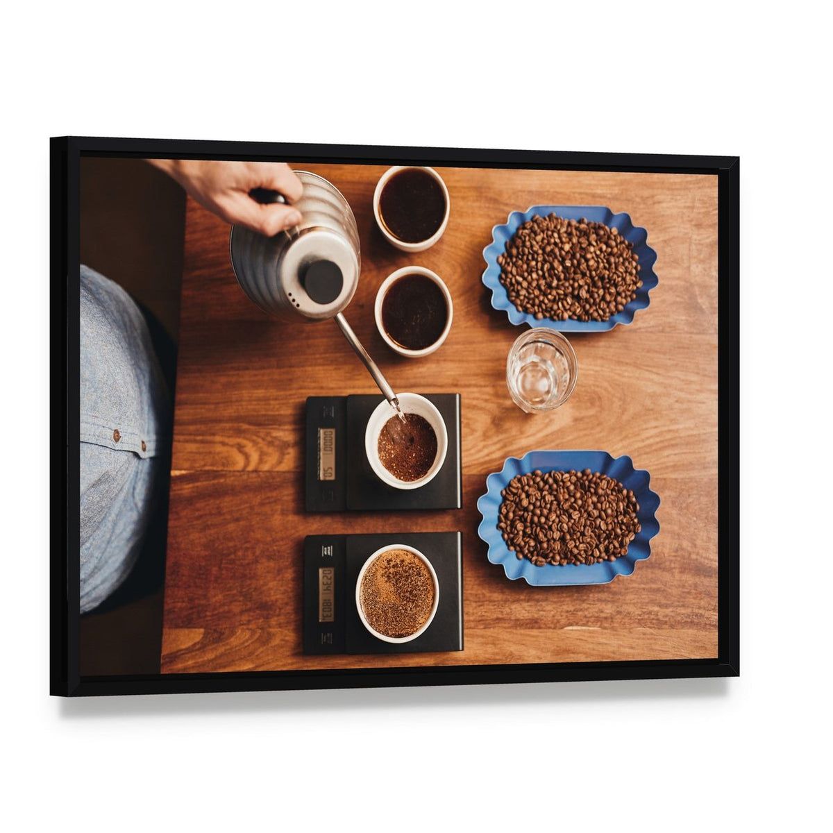 Four Coffee Cups on Table Canvas Wall Art, framed canvas in a black floater frame, angled product view
