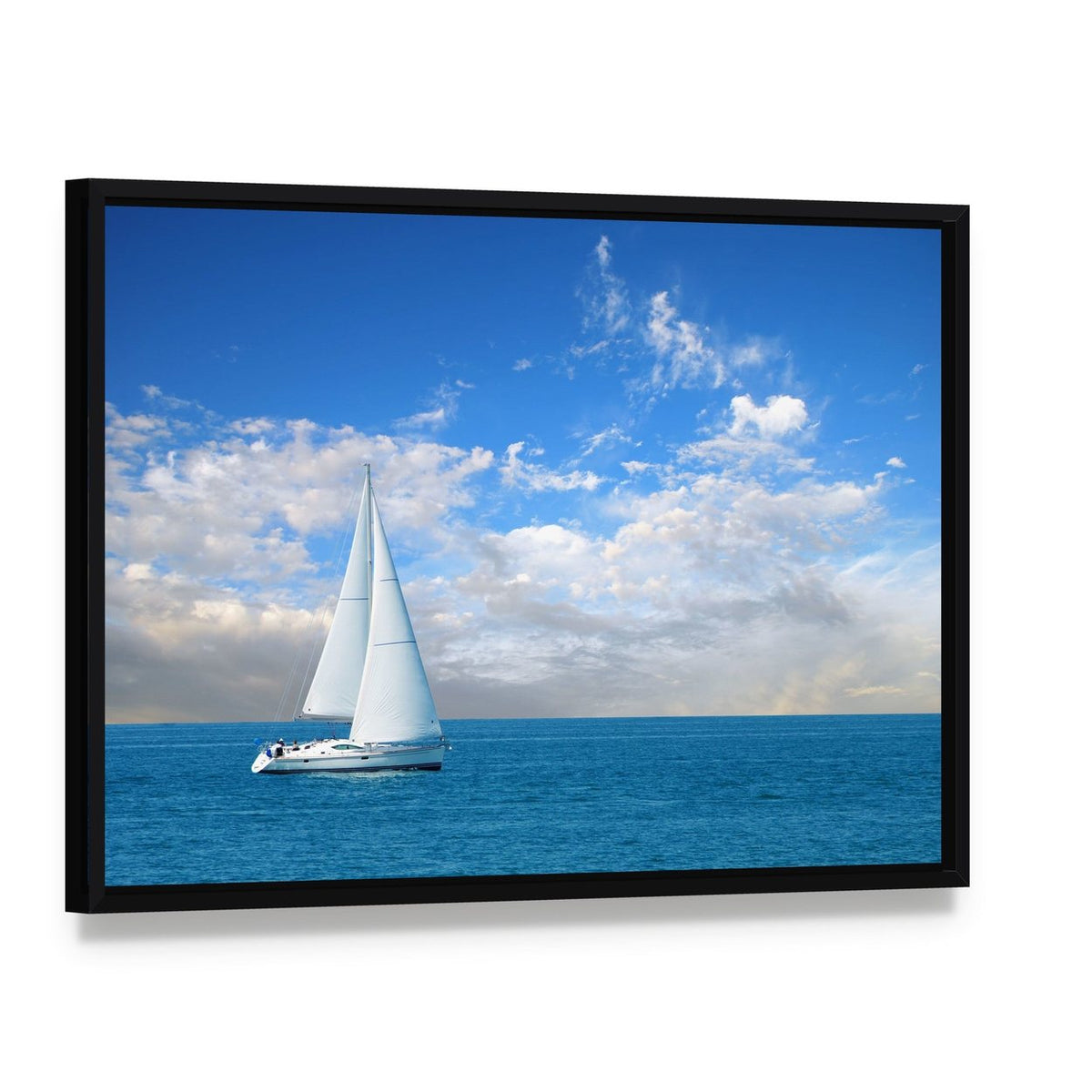 Modern Sail Boat Canvas Wall Art, framed canvas in a black floater frame, angled product view