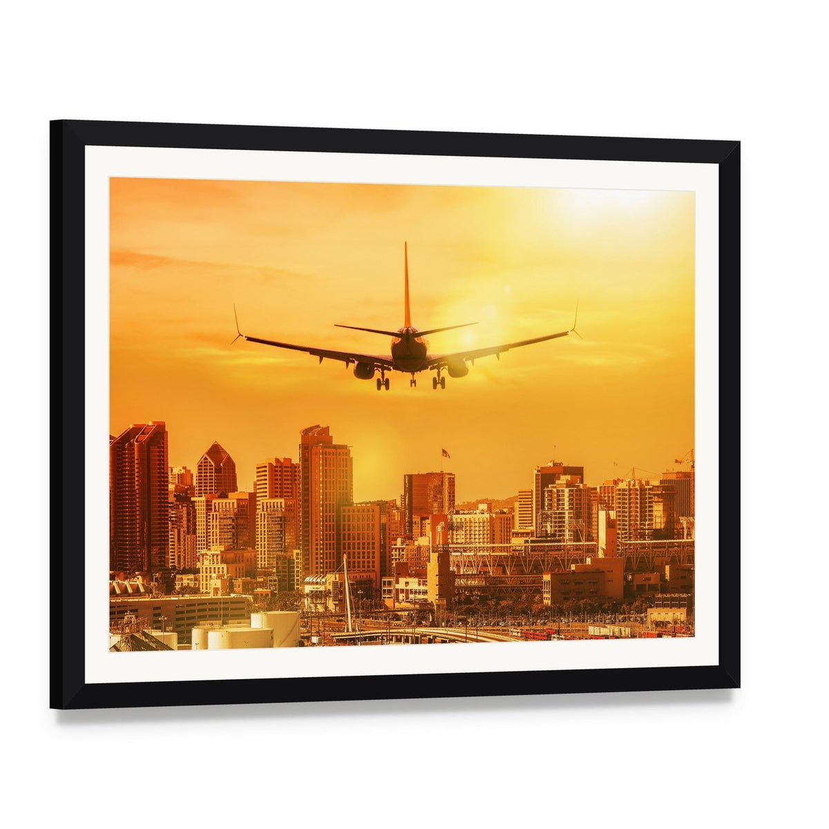Airplane Flying Towards City Skyline Canvas Wall Art, framed print with white mat and black frame, angled product view