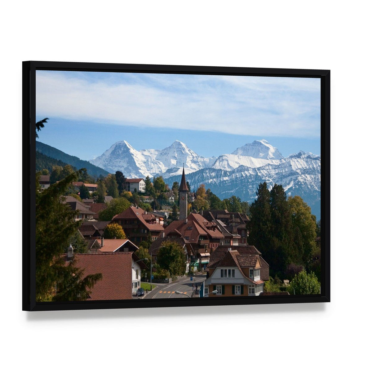 Typical Swiss Village with Snowy Peaks Canvas Wall Art, framed canvas in a black floater frame, angled product view