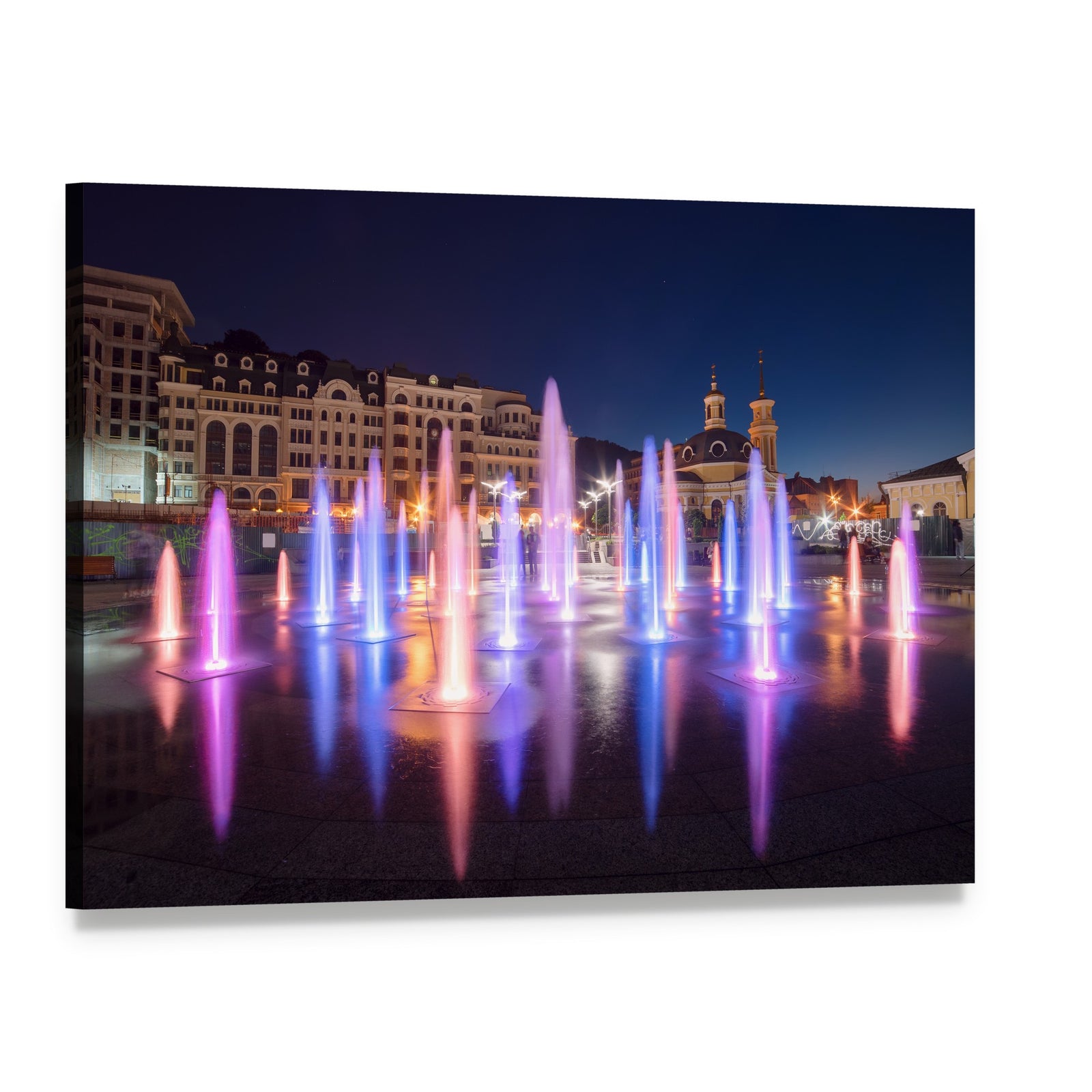Vibrant Night Cityscape with Colorful Fountains Canvas Wall Art, single panel gallery wrapped canvas, angled product view