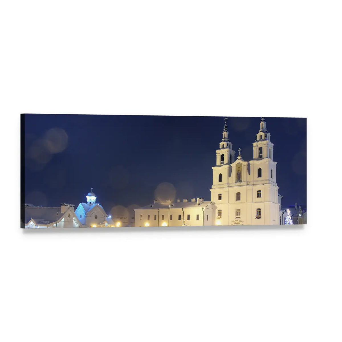 Twin-towered Church on Christmas Night Panoramic Canvas Wall Art, single panel gallery wrapped canvas, angled product view