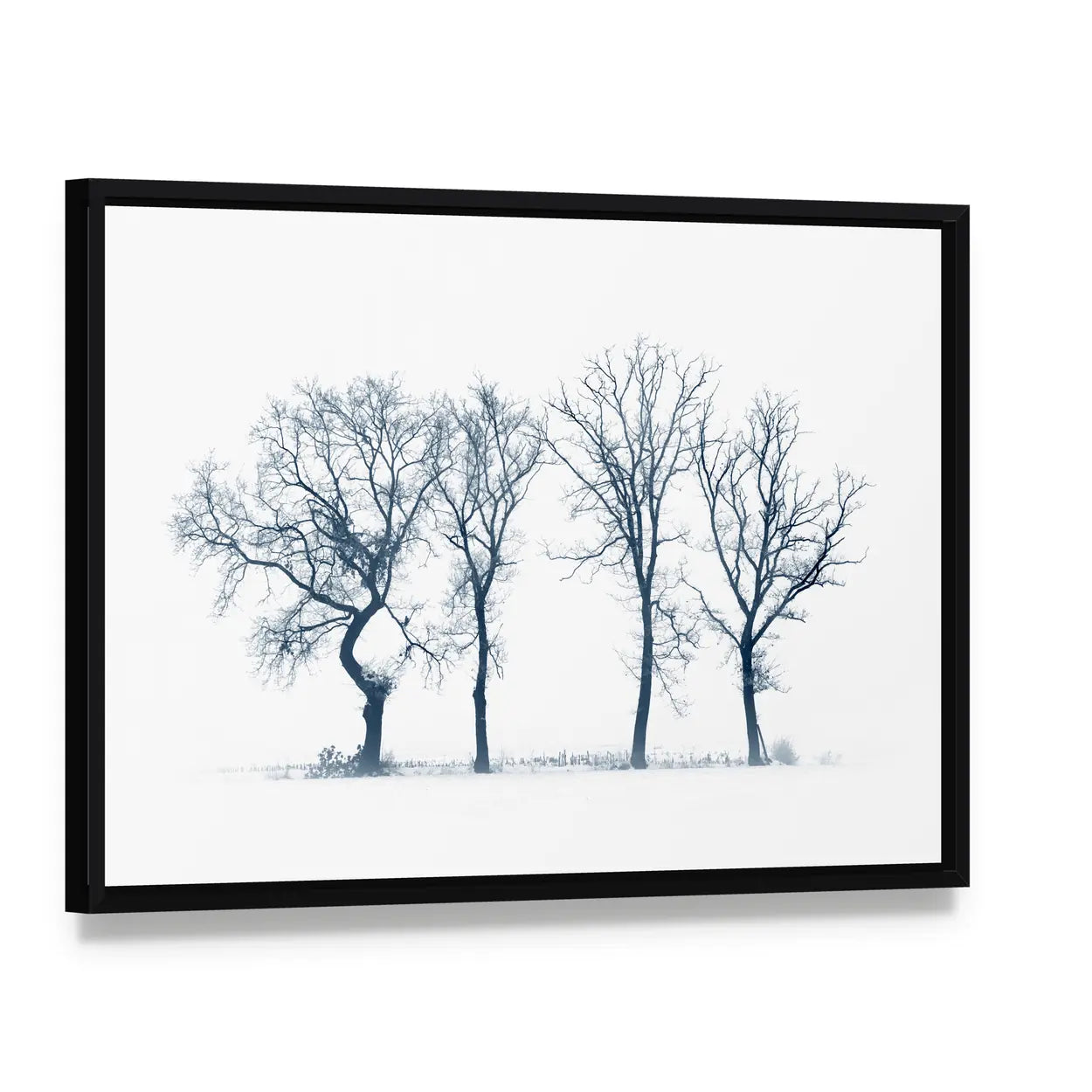 Four Bare Trees in Winter Canvas Wall Art, framed canvas in a black floater frame, angled product view