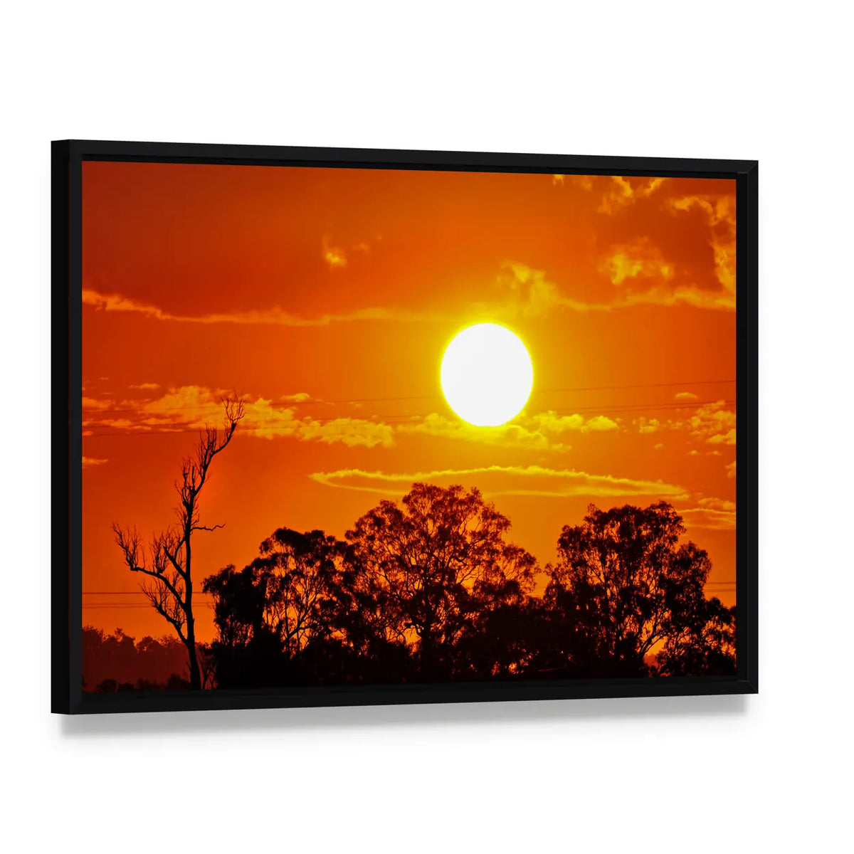Burning Sun Over Jungle Canvas Wall Art, framed canvas in a black floater frame, angled product view