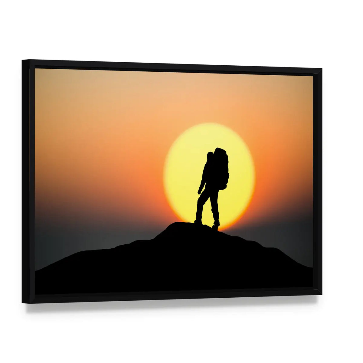 Silhouette Of Rock Climber On The Peak Canvas Wall Art, framed canvas in a black floater frame, angled product view
