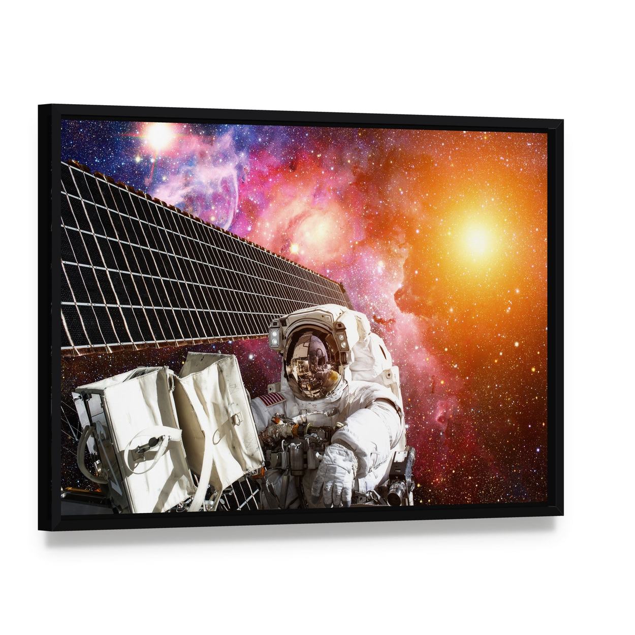 Space Station and Astronaut in Outer Space Canvas Wall Art, framed canvas in a black floater frame, angled product view