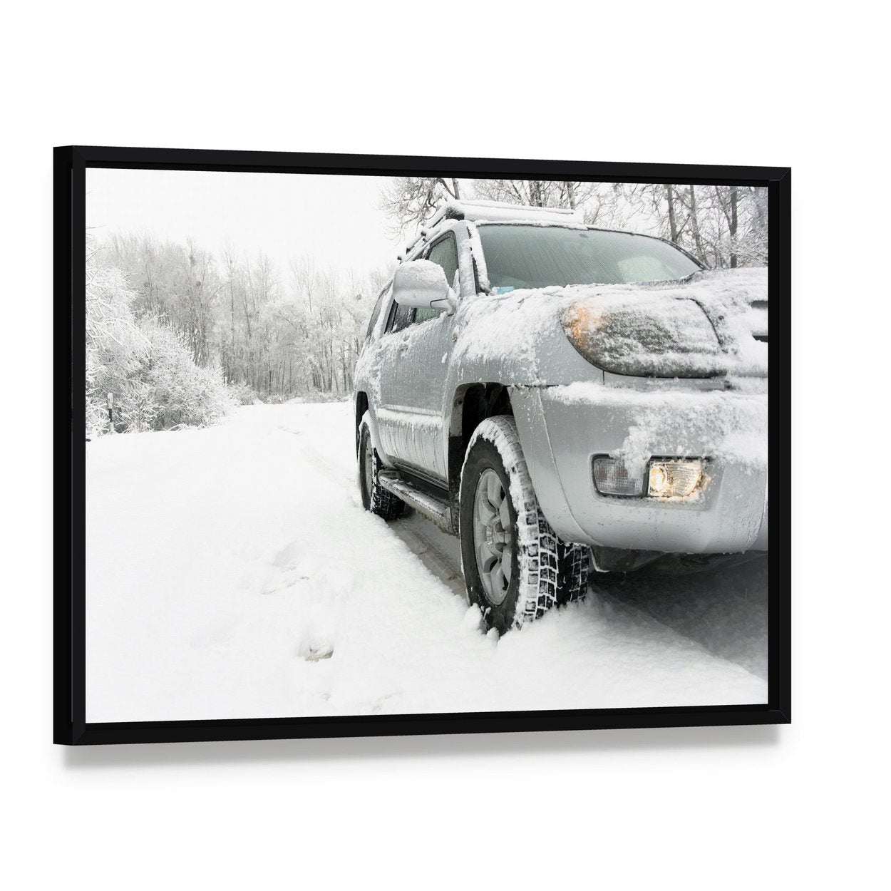 Snowy Winter Road Behind Car Canvas Wall Art, framed canvas in a black floater frame, angled product view