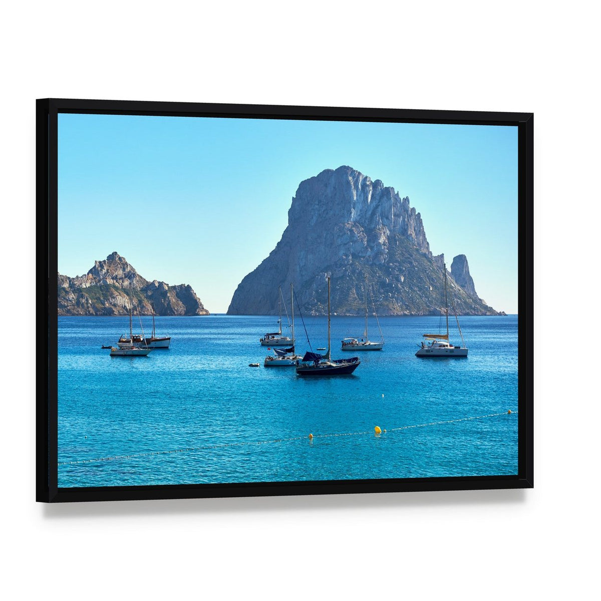 Es Vedra Island Canvas Wall Art, framed canvas in a black floater frame, angled product view