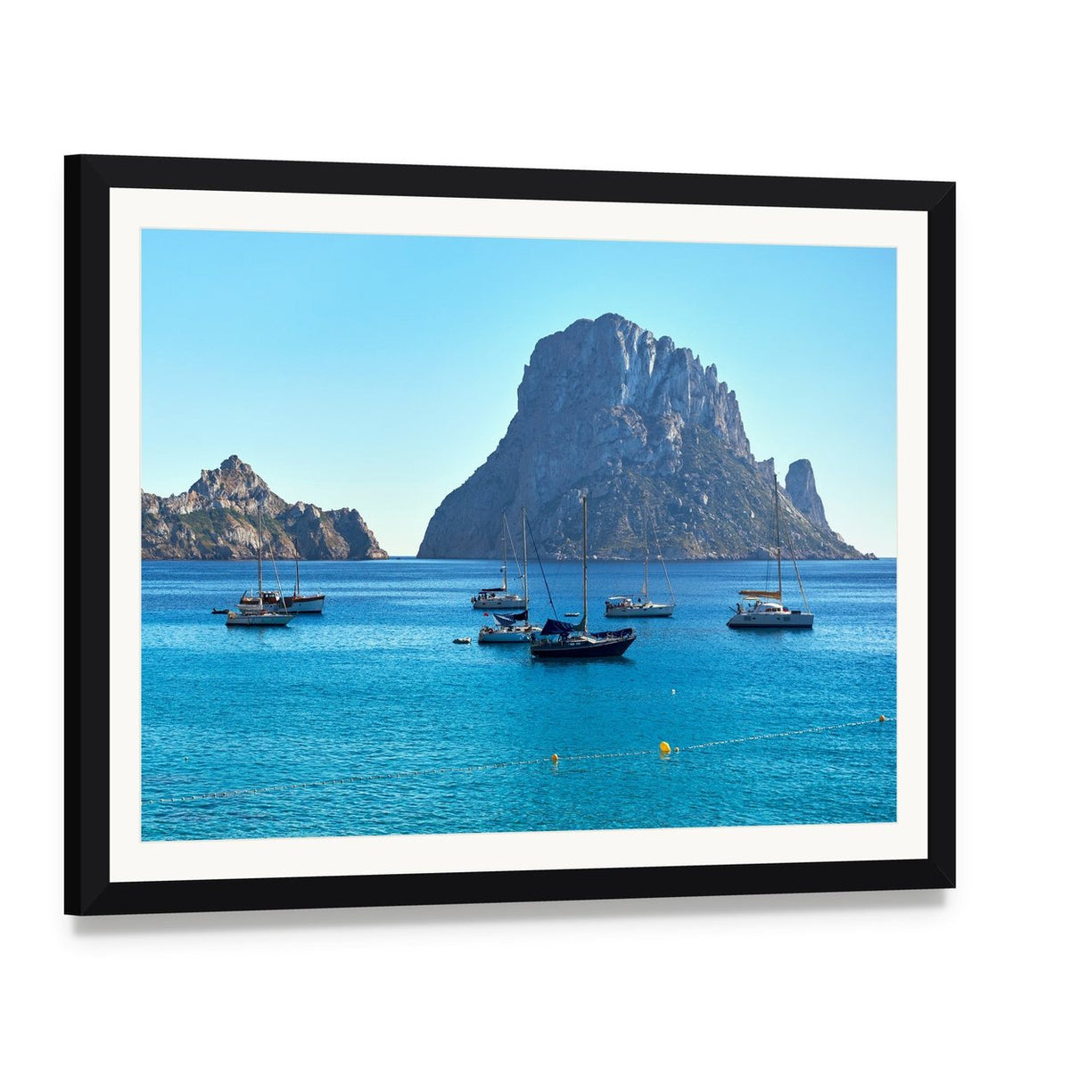 Es Vedra Island Canvas Wall Art, framed print with white mat and black frame, angled product view