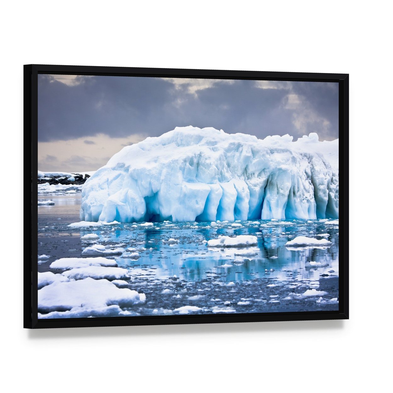 Huge Iceberg in Antarctica Canvas Wall Art, framed canvas in a black floater frame, angled product view