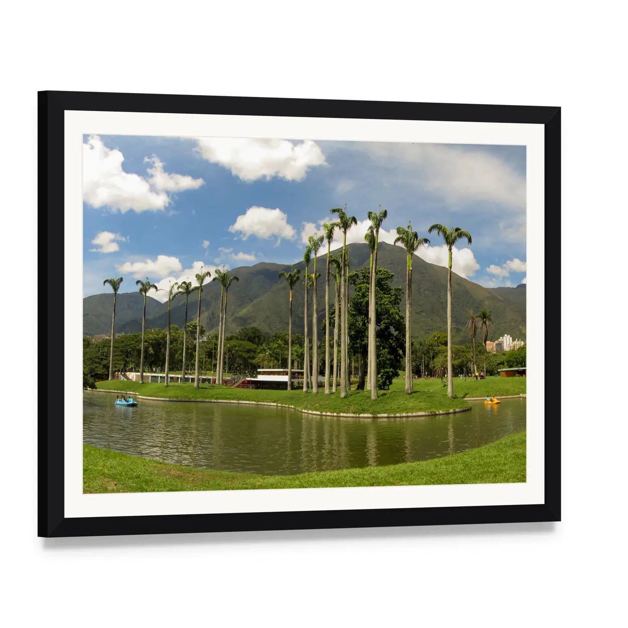 Palm-lined Mountain Lake with Two Boats Canvas Wall Art, framed print with white mat and black frame, angled product view