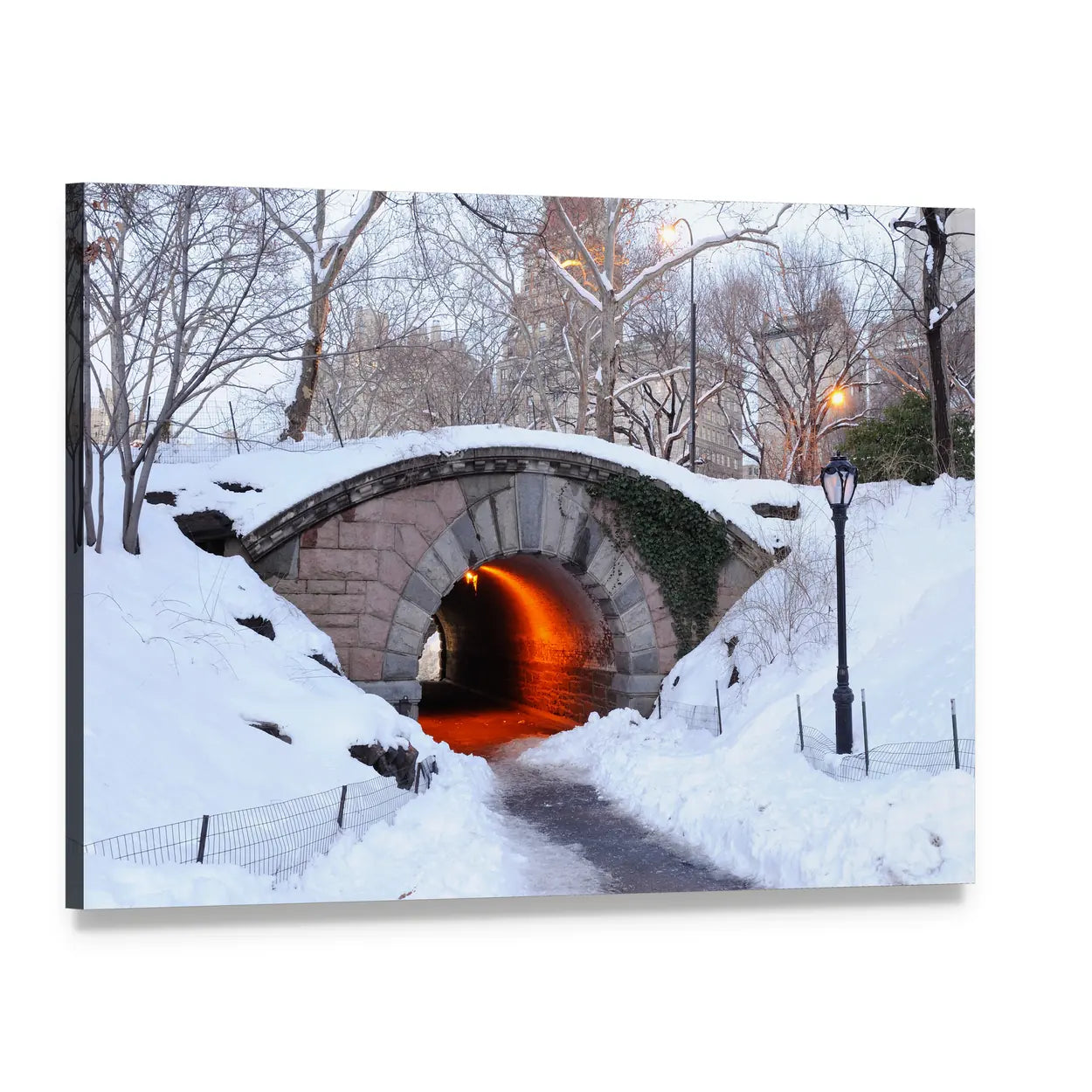 Snowy Stone Arch Bridge with Warm Tunnel Glow Canvas Wall Art, single panel gallery wrapped canvas, angled product view