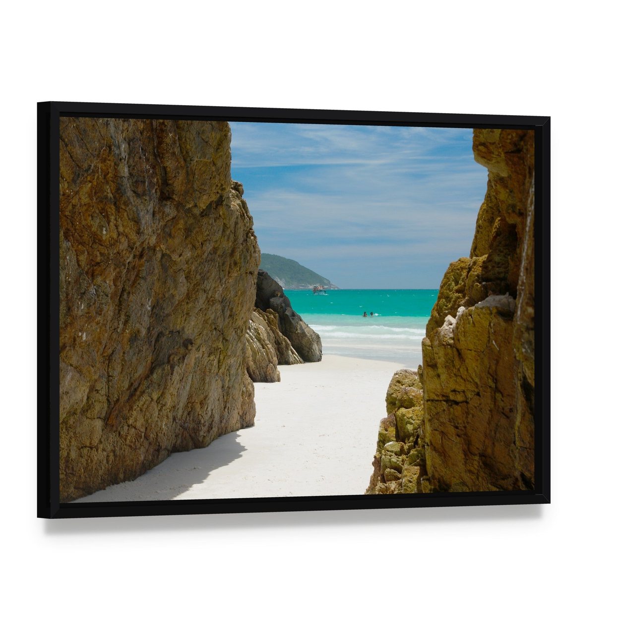Beach Cave Framed by Rocks Canvas Wall Art, framed canvas in a black floater frame, angled product view
