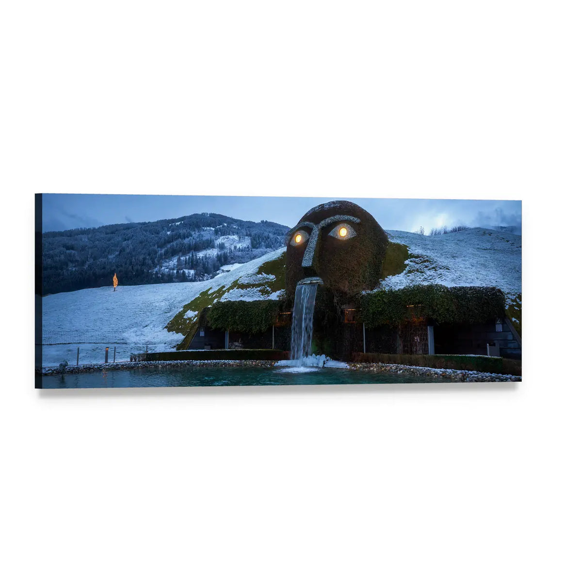 Giant Head Sculpture with Waterfall and Glowing Eyes Panoramic Canvas Wall Art, single panel gallery wrapped canvas, angled product view