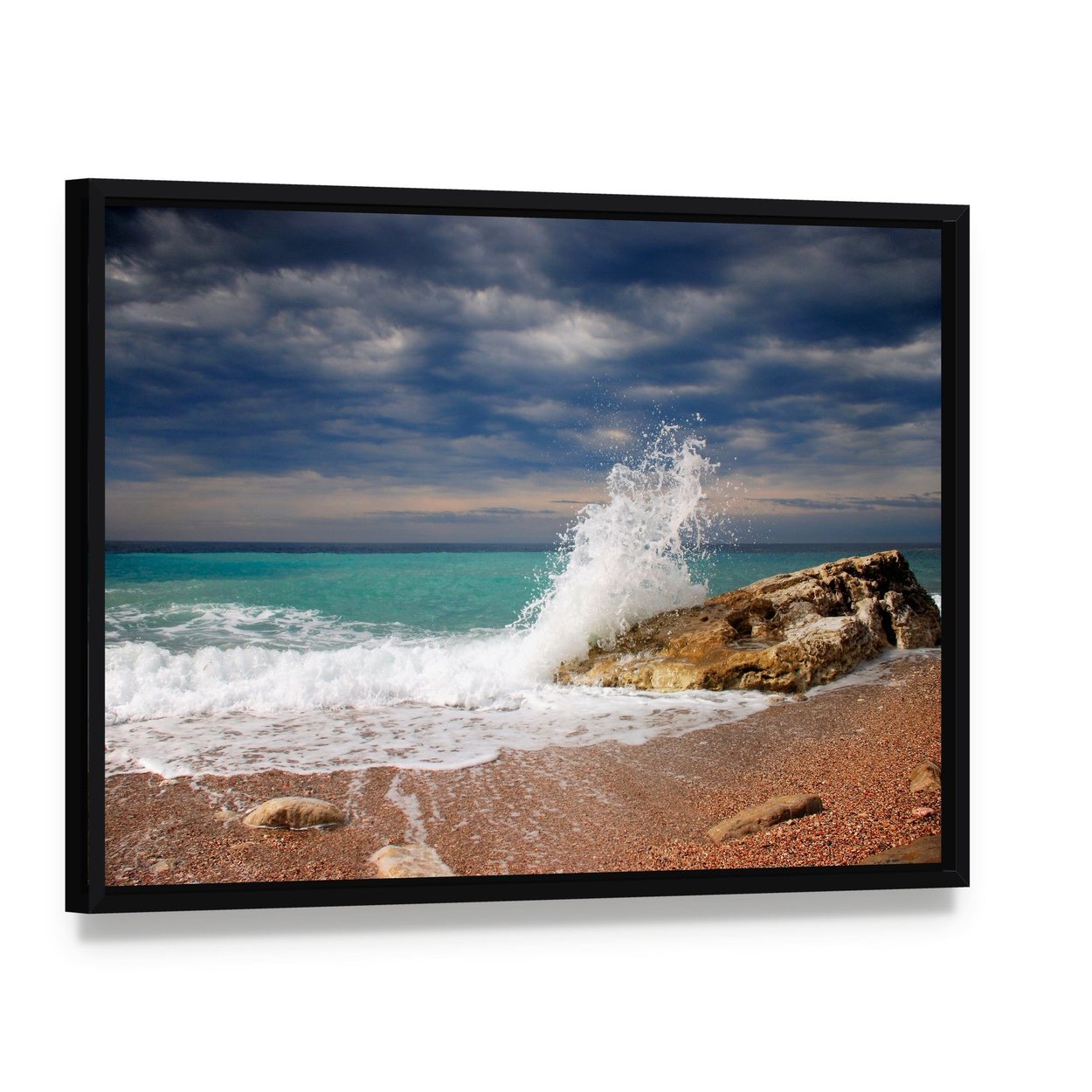 Wave Crash on the Stone Canvas Wall Art, framed canvas in a black floater frame, angled product view