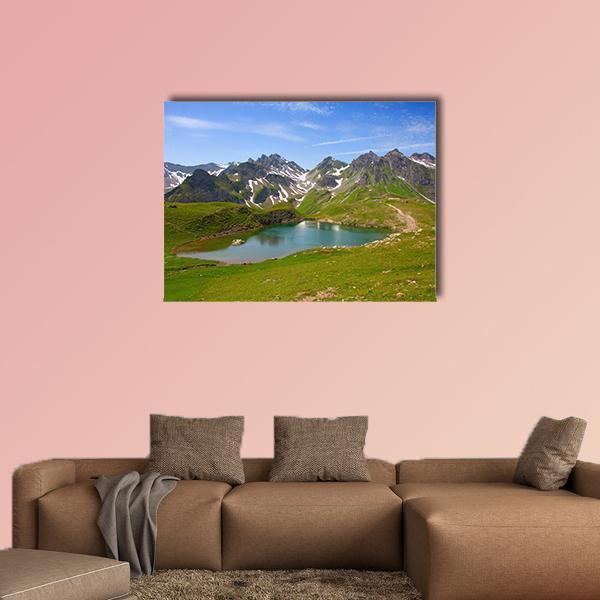 Summer Alpine Lake Landscape Canvas Wall Art in gray, green and blue, single panel hung on a wall
