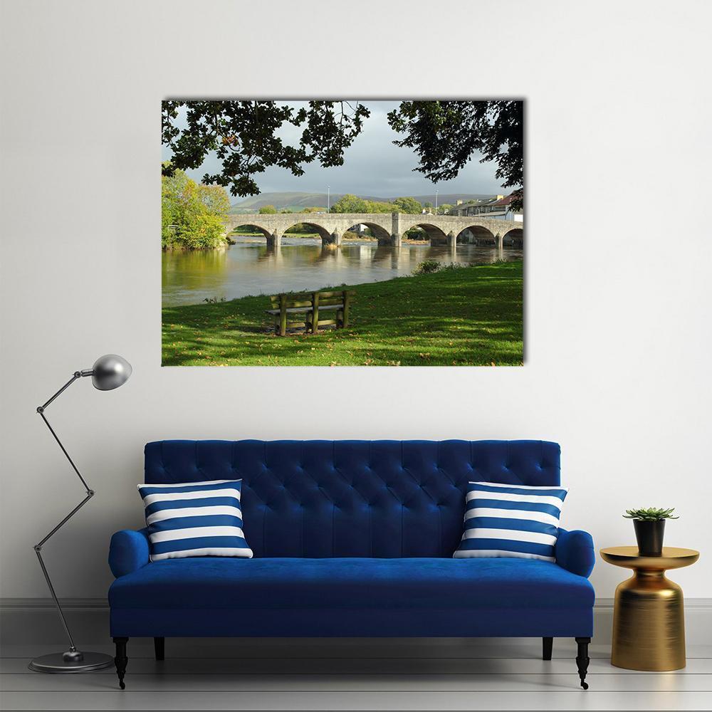 Bridge Over River Wye Canvas Wall Art in gray, brown and green, single panel hung on a wall