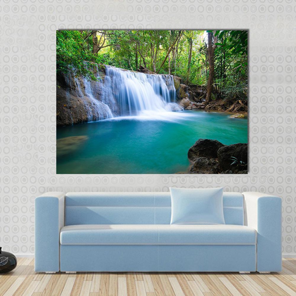 Kanchanaburi Waterfall in Lush Forest Canvas Wall Art in green and blue, single panel hung on a wall