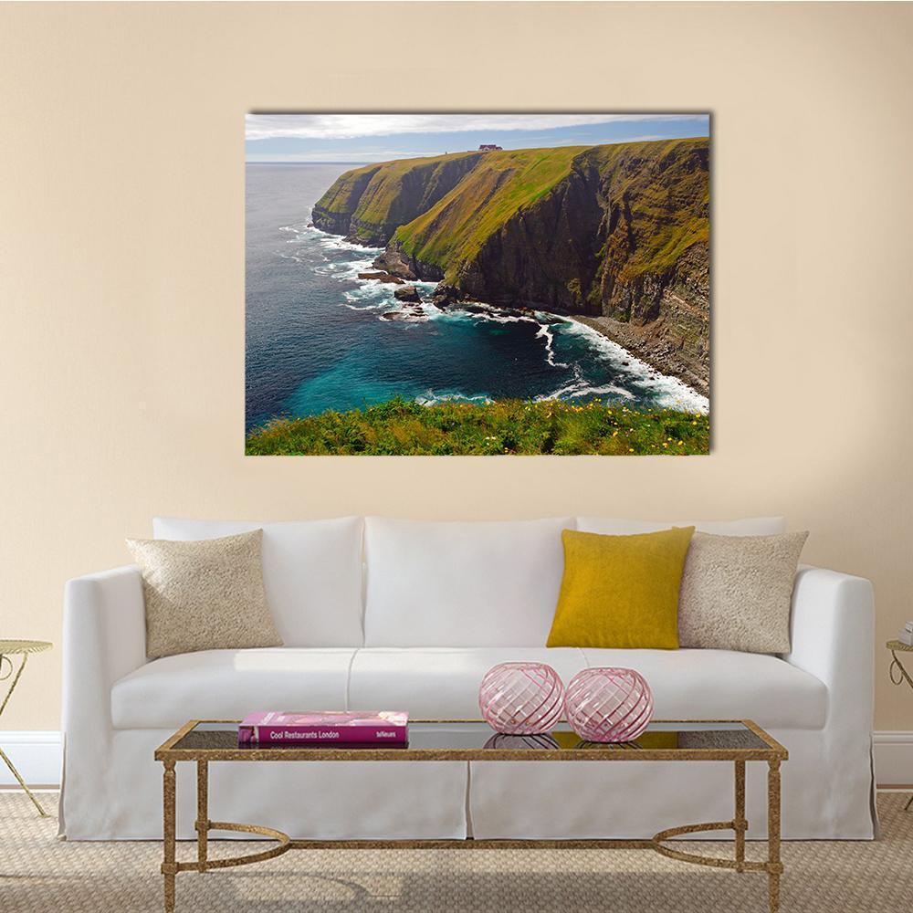 Cliff at Cape St Mary Canvas Wall Art in brown, green and blue, single panel hung on a wall