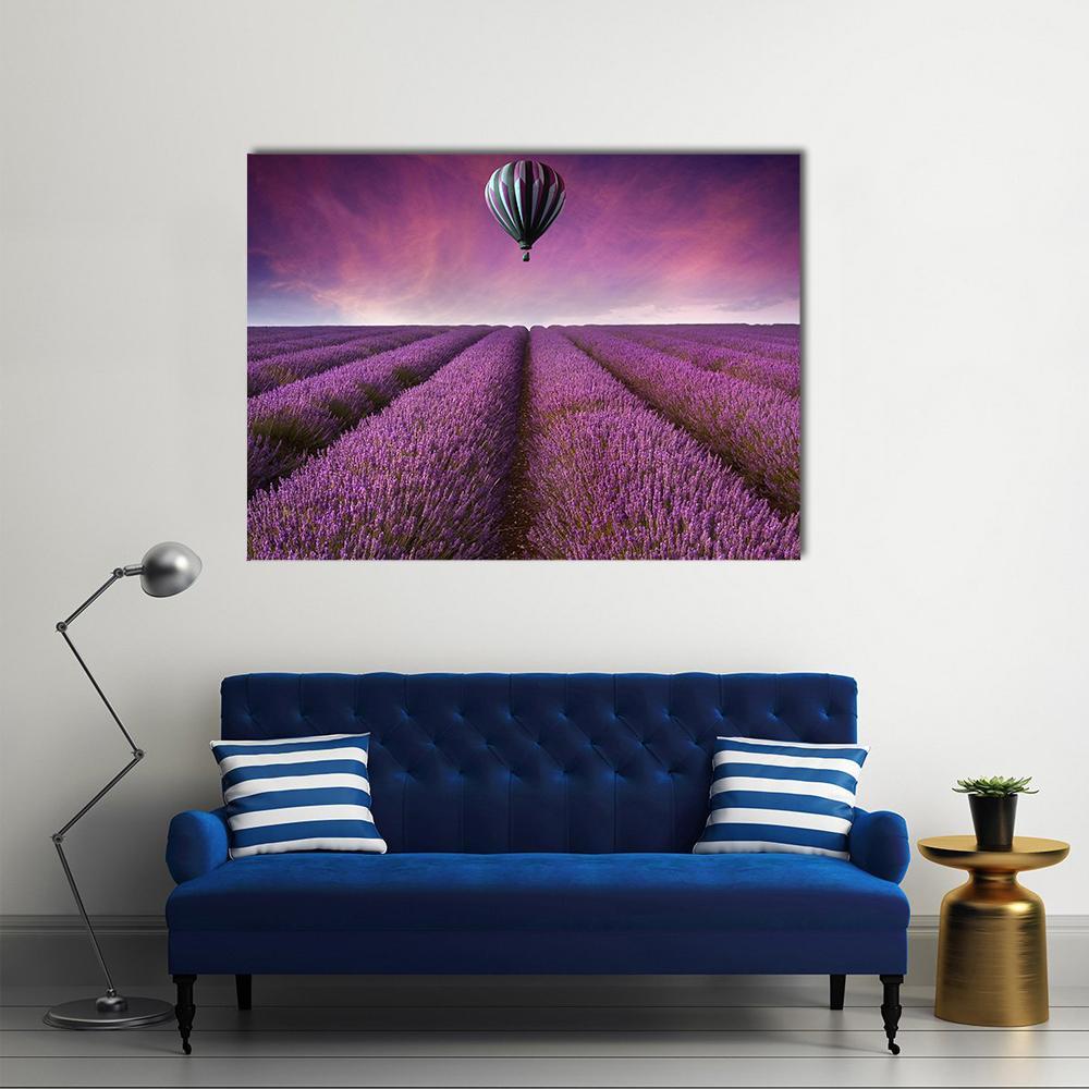 Striped Hot Air Balloon Over Lavender Field Canvas Wall Art in purple and pink, single panel hung on a wall