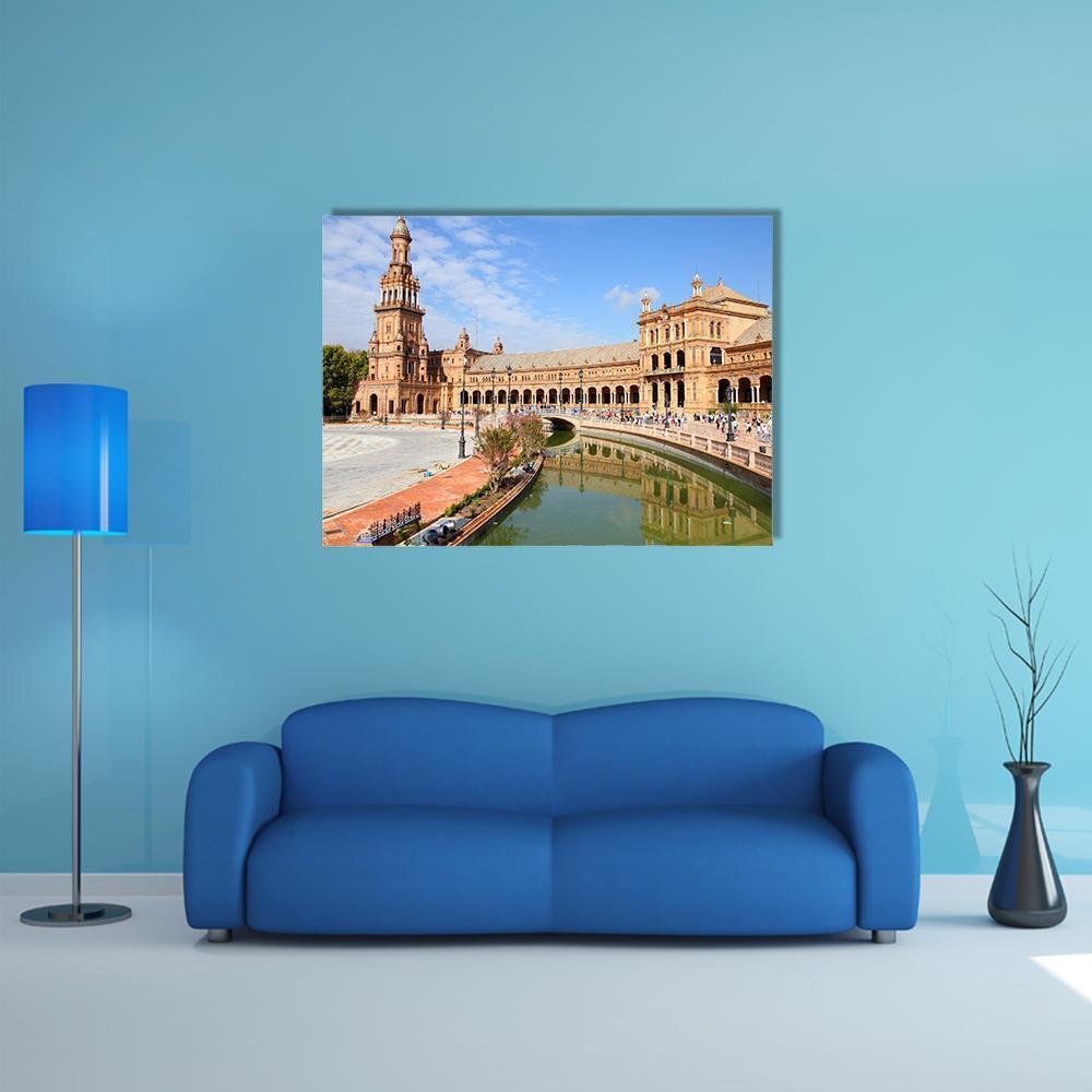 Plaza De España with Canal and Bridge Canvas Wall Art in brown, orange and blue, single panel hung on a wall