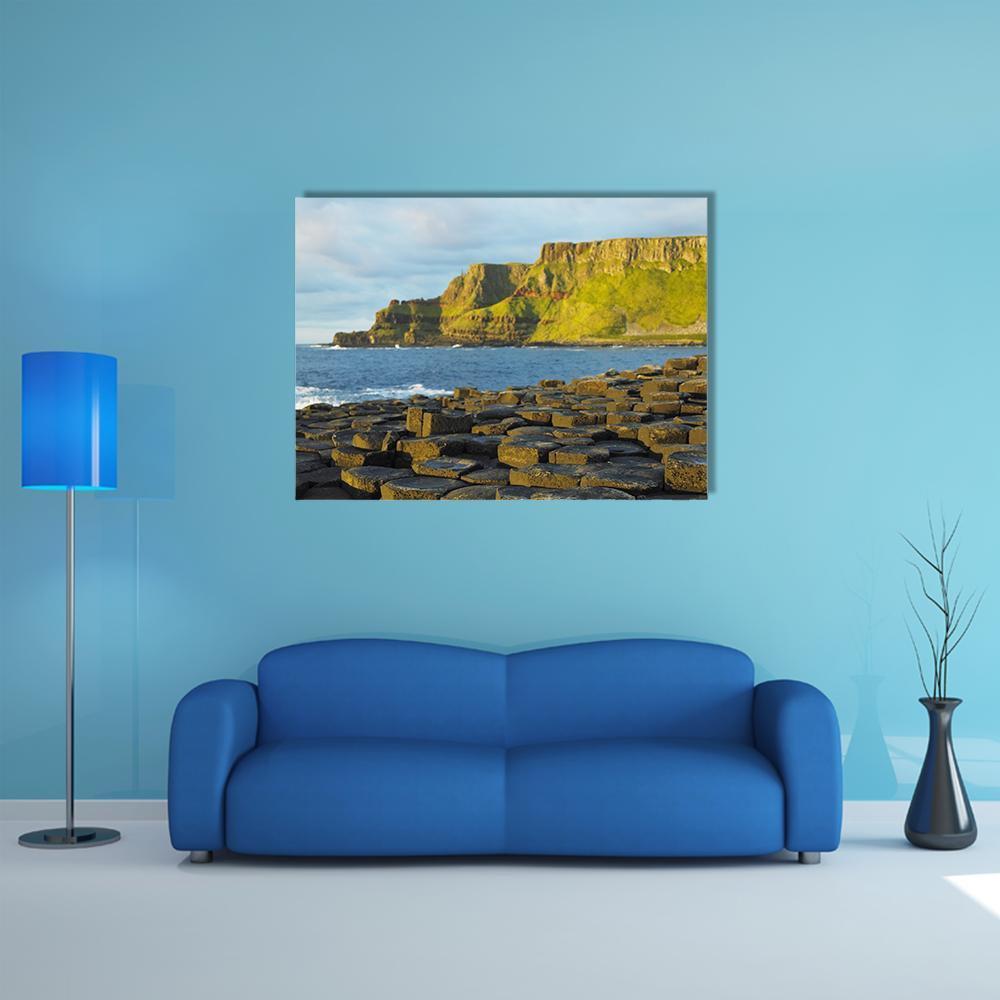 Giant's Causeway Basalt Columns Canvas Wall Art in brown, green and blue, single panel hung on a wall