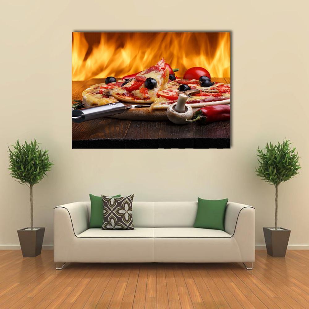 Wood-fired Pizza with Flames Canvas Wall Art in brown, red and orange, single panel hung on a wall