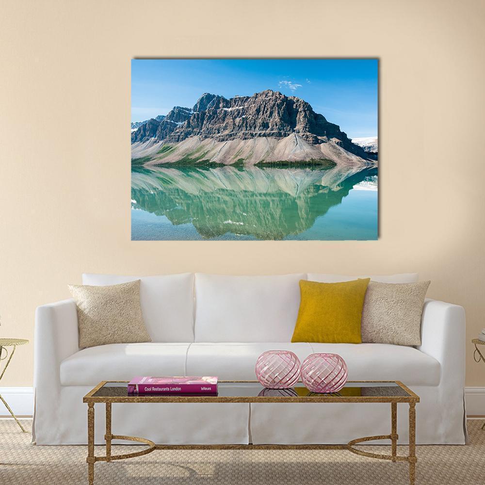 Bow Lake Canada Reflection Canvas Wall Art in gray, green and blue, single panel hung on a wall