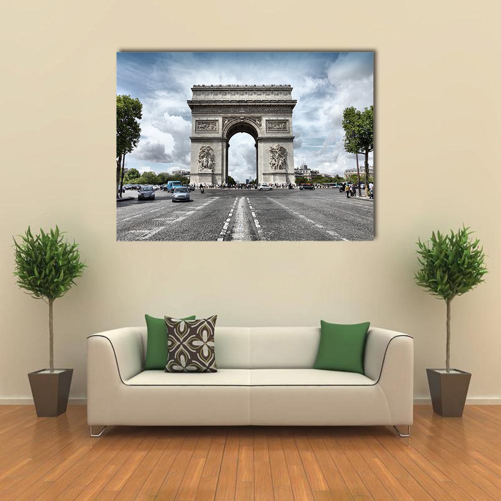 Arc De Triomphe on Paris Avenue Canvas Wall Art in white, gray and blue, hung on a wall