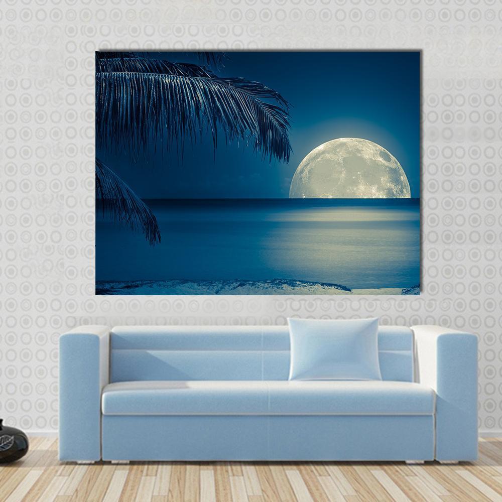Moon Reflected on Water Canvas Wall Art in white, blue and navy, single panel hung on a wall