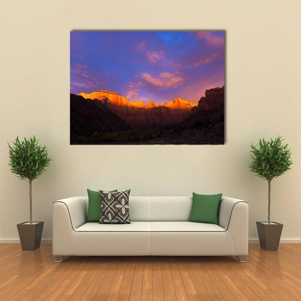Towers of the Virgin at Sunset Canvas Wall Art in orange, blue and purple, single panel hung on a wall