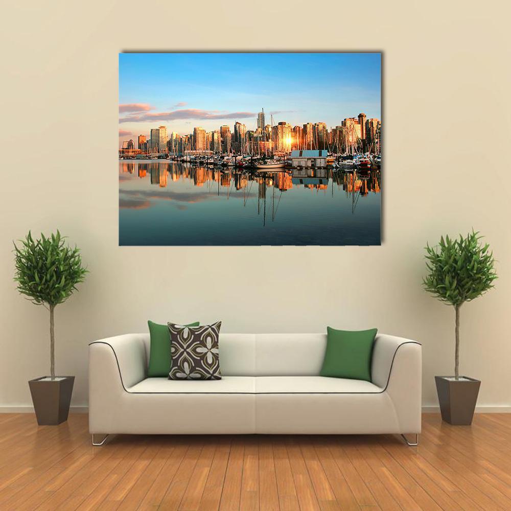 Vancouver Skyline at Sunset Canvas Wall Art in orange, yellow and blue, single panel hung on a wall